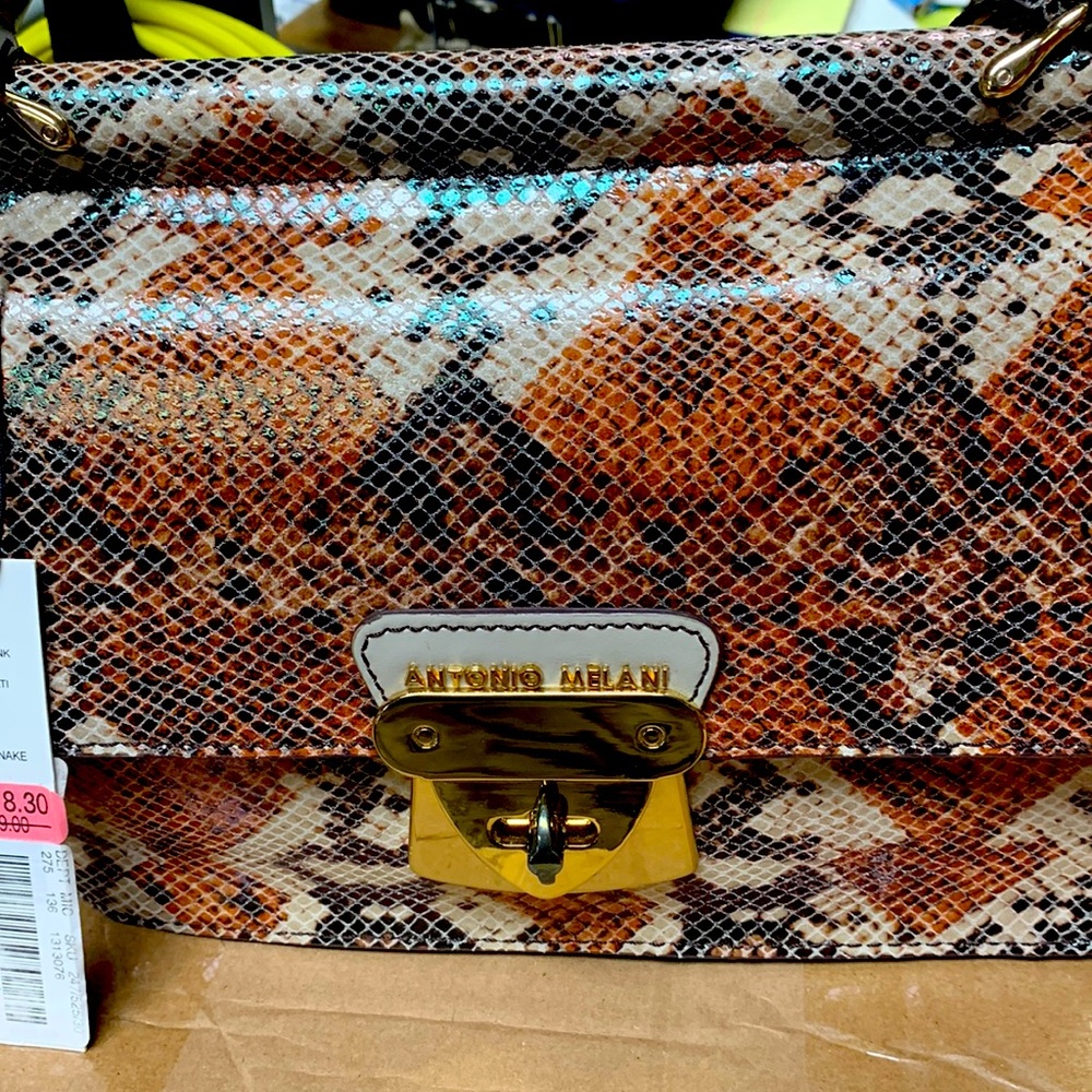 Brand new with tags. Never used. Antonio Melani snakeskin purse.